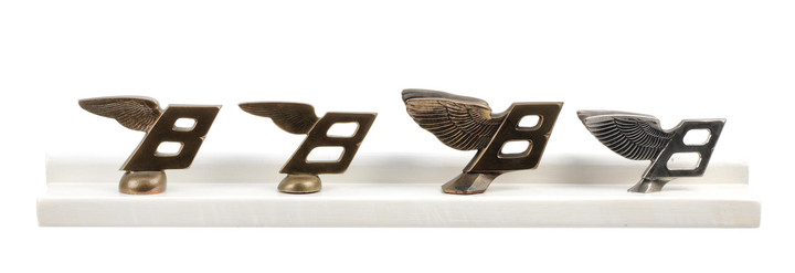 W. O. Bentley's personal collection of prototype castings of the post-1931 Bentley winged B mascot development process