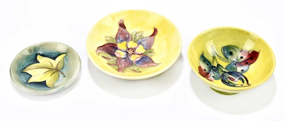 WALTER MOORCROFT; two footed bowls, to include an example decorated...
