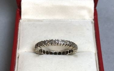 White gold wedding band (to be checked) and...