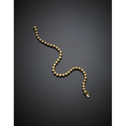 Yellow gold tennis bracelet, g 17.45 circa, length cm 19.20 circa.Read more