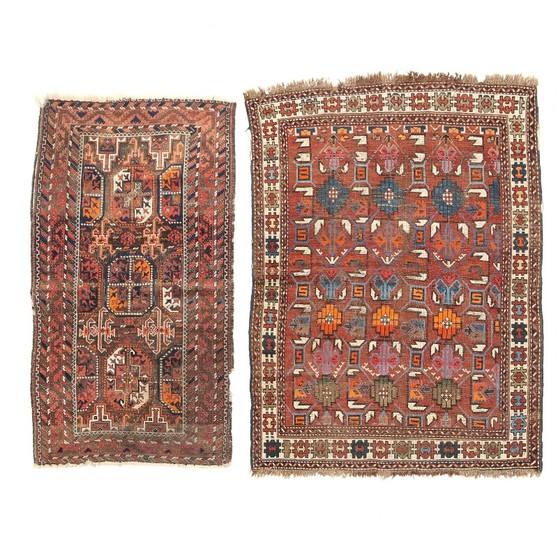 sTwo Nomad rugs, classic design with ornaments on brown and reddish base. 20th century first half. 158×83 and 167×120 cm. (2)