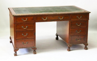 A LATE EDWARDIAN MAHOGANY PEDESTAL DESK, with gadrooned