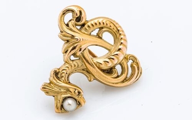 18 karat (750 thousandths) yellow gold clip stylizing a dragon...