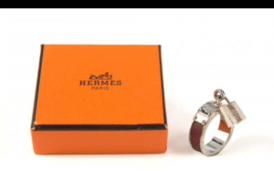 HERMES Metal and leather scarf ring with hanging logo....