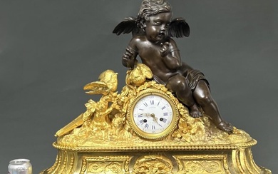 19th century French Dore bronze and patinated bronze mantel clock with Putti