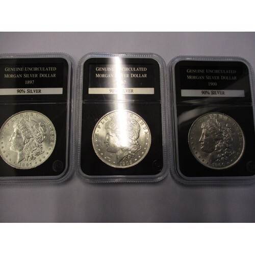 3 Uncirculated American Morgan silver dollar coins, each bei...