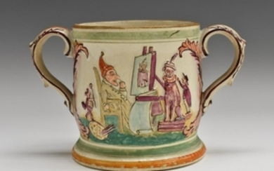 A 19th century English pottery loving cup, moulded in
