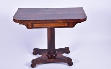 A 19th century Rosewood fold-over card table on an inverted tapering column and quatrefoil base, 90 cm wide.