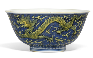 A BLUE-GROUND YELLOW-ENAMELLED 'DRAGON' BOWL, KANGXI SIX-CHARACTER MARK IN UNDERGLAZE BLUE WITHIN A DOUBLE CIRCLE AND OF THE PERIOD (1662-1722)