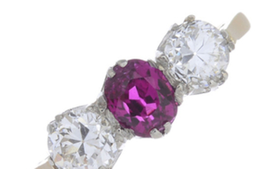 A ruby and diamond three-stone ring.
