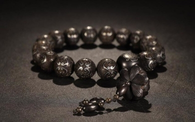 A SILVER 18 BEADS BRACELET WITH LOTUS LINES