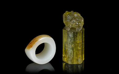A white and russet jade thumb ring and a green tourmaline seal