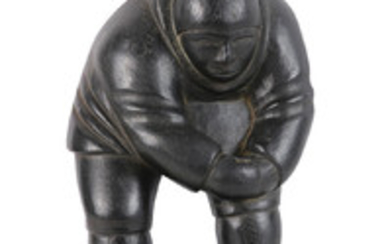 Eskimo carved sculpture by Johnny Inukpuk , depicting an Eskimo surmounting a seal, verso inscribed, and numbered...