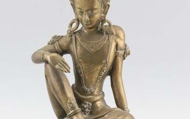 NEPALESE BRONZE FIGURE OF BUDDHA Seated on a lotus base. Paper label affixed to back. Height 10".