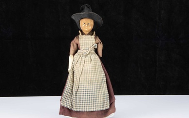 A 19th century English wax over papier-mâché doll in Welsh traditional costume