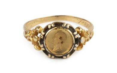 A 19th century gold memorial ring, having glazed relief portrait,...