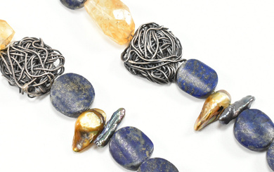 A 925 silver lapis lazuli, citrine & baroque pearl bead necklace. The necklace comprised of graduating mottled blue lapis disk beads, organically shaped & faceted yellow to white ombré citrine beads, yellow & purple baroque pearls & knotted wirework...