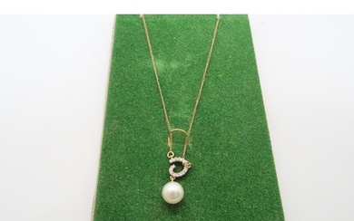 A 9ct yellow gold pearl and diamond pendant on 22 inch chain...