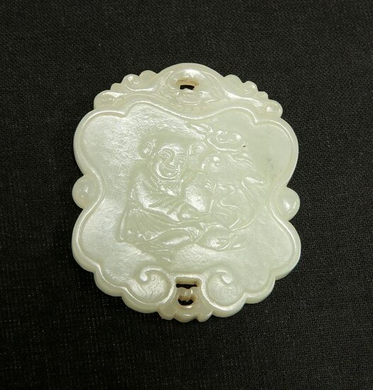 A CHINESE CELADON JADE PENDANT, carved to one side with