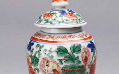 A CHINESE WUCAI 'PEONY AND LION' JAR AND COVER