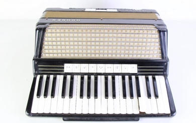 A Cased Hohner Accordian-Some wear