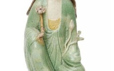 A Chinese biscuit porcelain sancai Guanyin figure...