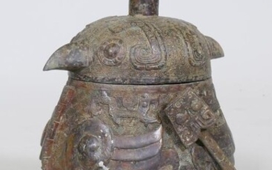 A Chinese bronze vessel with archaic style raised decoration...