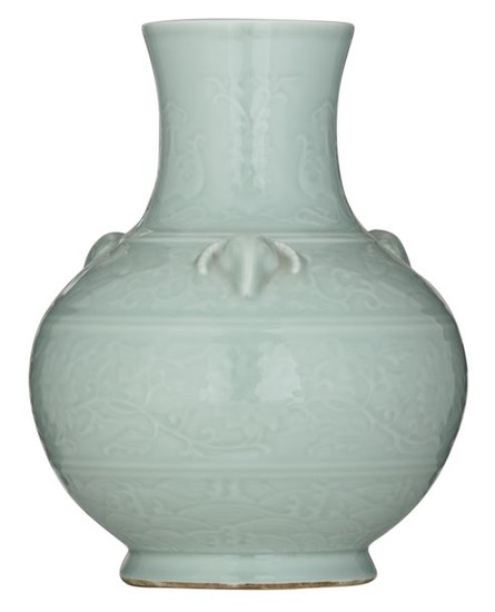 A Chinese celadon relief bottle vase, the handles...
