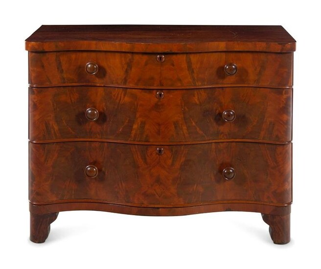 A Continental Walnut Serpentine-Front Chest of Drawers