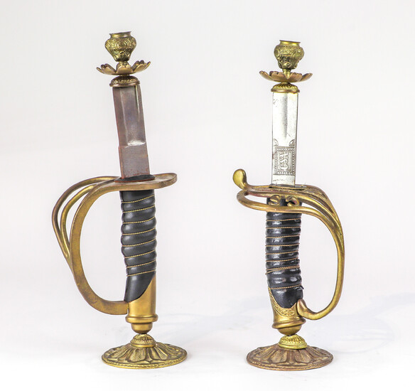 A Continental pair of swords converted into candlesticks