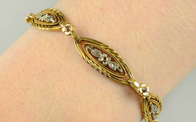 A French Art Nouveau platinum and 18ct gold, ruby and diamond point floral bracelet.