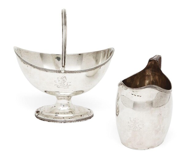 A George III silver bonbon dish, London, 1797, Robert Hennell I & David Hennell II, together with a cream jug by the same maker, London, 1800, both engraved with lion crest and designed with reeded rims and handles, the bonbon dish 11.5cm high, the...