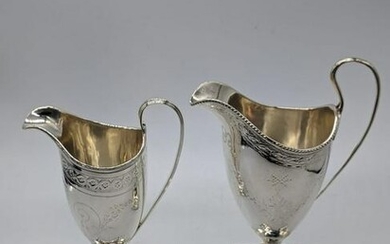 A George III silver cream jug by Henry Chawner