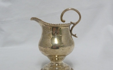 A George III silver cream jug, of squat baluster form with g...