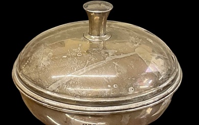A George V hallmarked silver lidded sugar bowl of circular...