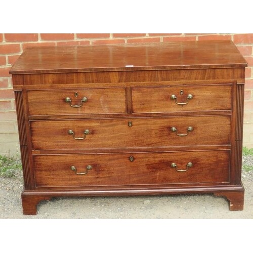 A Georgian mahogany straight front chest of two short over t...