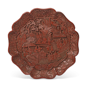 A LARGE CARVED CINNABAR LACQUER LOBED DISH, MING DYNASTY, 16TH CENTURY