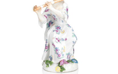 A Meissen figure of a lady playing the flute