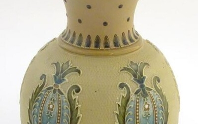 A Mettlach vase with a flared rim and bulbous body