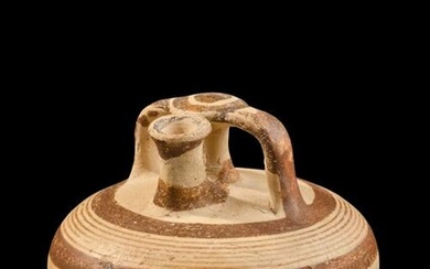 A Mycenaean Pottery Stirrup Jar Height 4 1/2 inches.