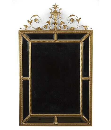 A Neoclassical Style Gesso and Giltwood Mirror.