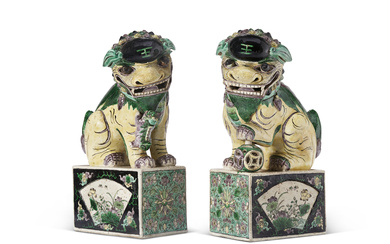 A PAIR OF CHINESE EXPORT PORCELAIN BUDDHISTIC LIONS ON STANDS...