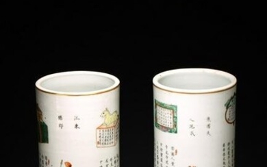 A PAIR OF CHINESE FAMILLE ROSE FIGURES CYLINDRICAL