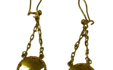 A PAIR OF CONTINENTAL YELLOW METAL EARRINGS A pierced map of...