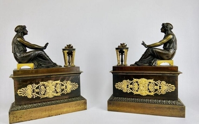 A PAIR OF EMPIRE STYLE GILT AND PATINATED BRONZE CHENET