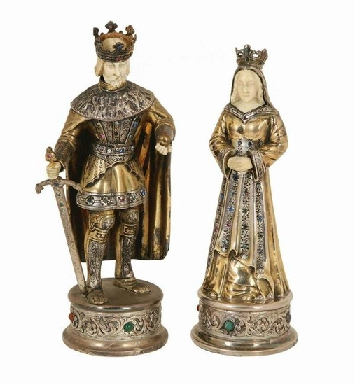 A PAIR OF GERMAN SILVER, GILT AND JEWELED STATUETTES MODELLED AS A MEDIEVAL KING AND QUEEN