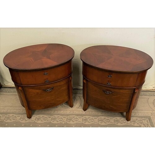 A PAIR OF OVAL TWO DRAWER WALNUT SIDE LOCKERS, with crossban...