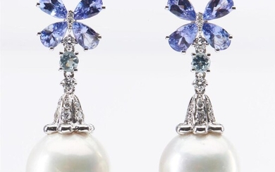 A PAIR OF SOUTH SEA PEARL, TANZANITE AND DIAMOND DROP EARRINGS, THE PEARLS MEASURING 12.2MM, IN 18CT WHITE GOLD, TOTAL LENGTH 30MM,...