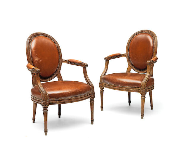 A Pair of Louis XVI carved beechwood fauteuils