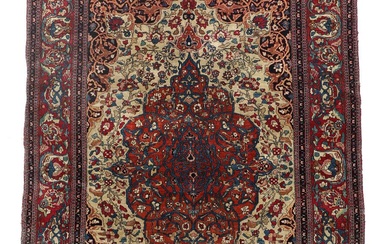 A Persian 20th century Isfahan rug, classic medallion design with ornaments, flowers...